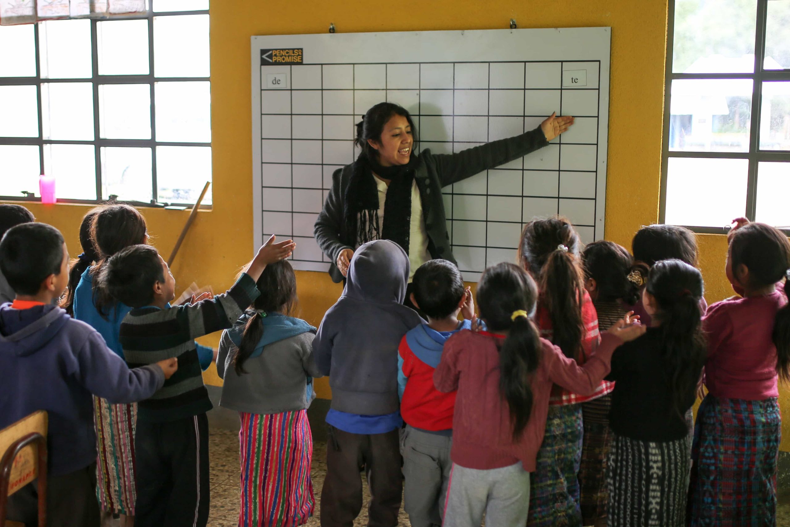 A teacher in Guatemala conducts a lesson in her classroom at a PoP supported school.